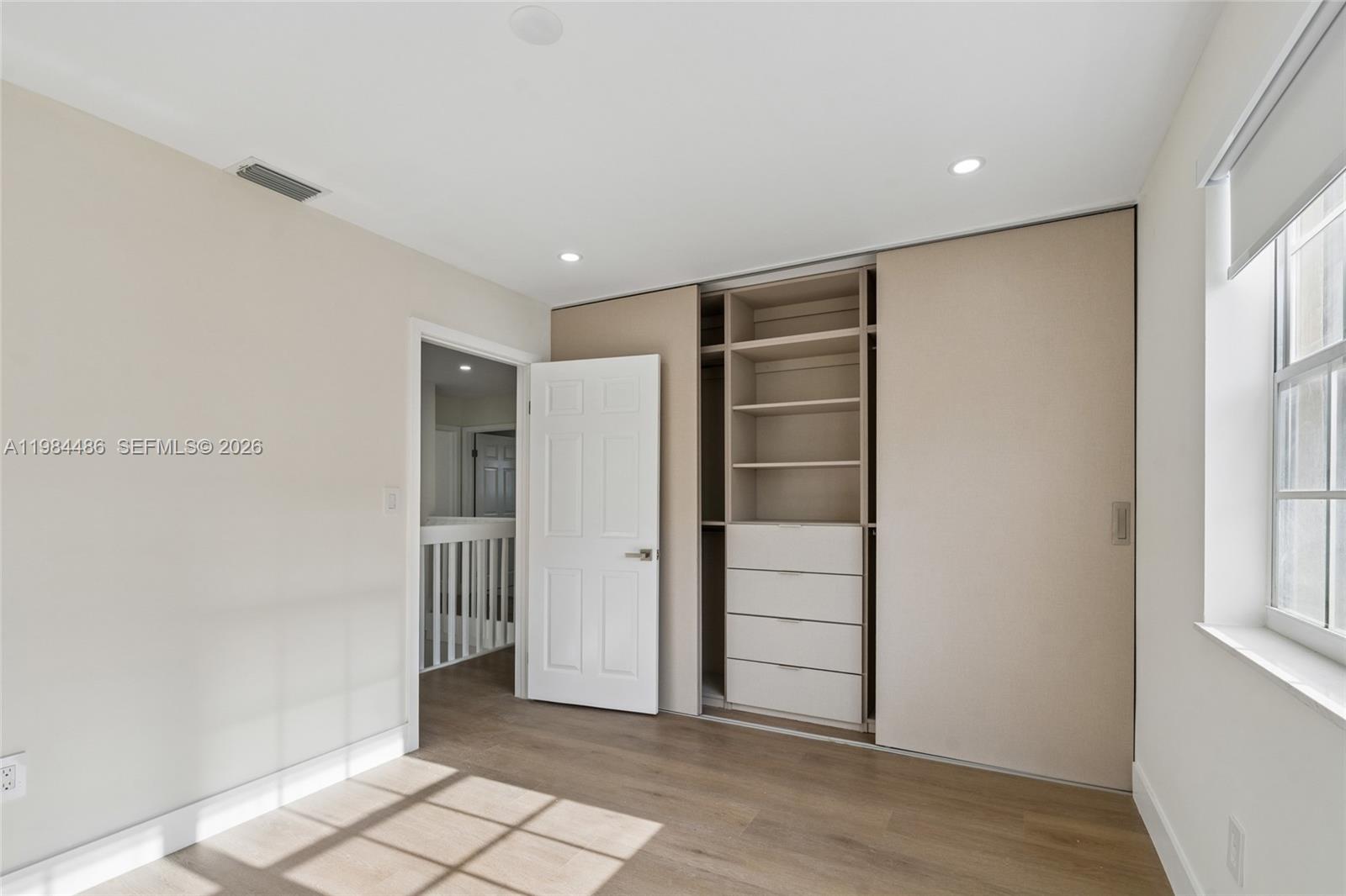 15174 Southwest 111th Street Miami, FL 33196 - Photo 27 of 49 a view of an empty room with closet and entryway