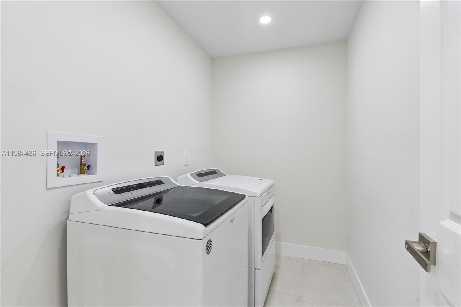 15174 Southwest 111th Street Miami, FL 33196 - Photo 33 of 49 a utility room with dryer and washer