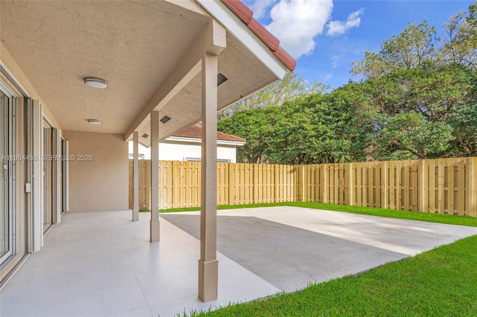 15174 Southwest 111th Street Miami, FL 33196 - Photo 37 of 49 a view of backyard with tub and trees in the background