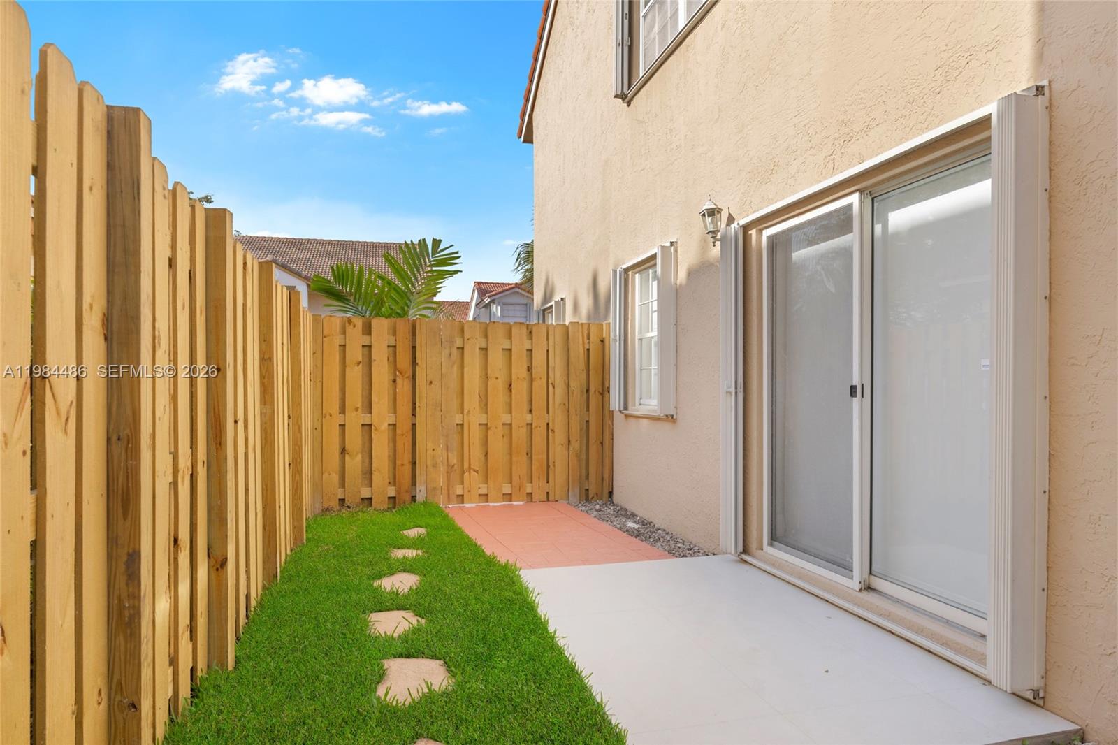 15174 Southwest 111th Street Miami, FL 33196 - Photo 40 of 49 a view of a garden with a pathway