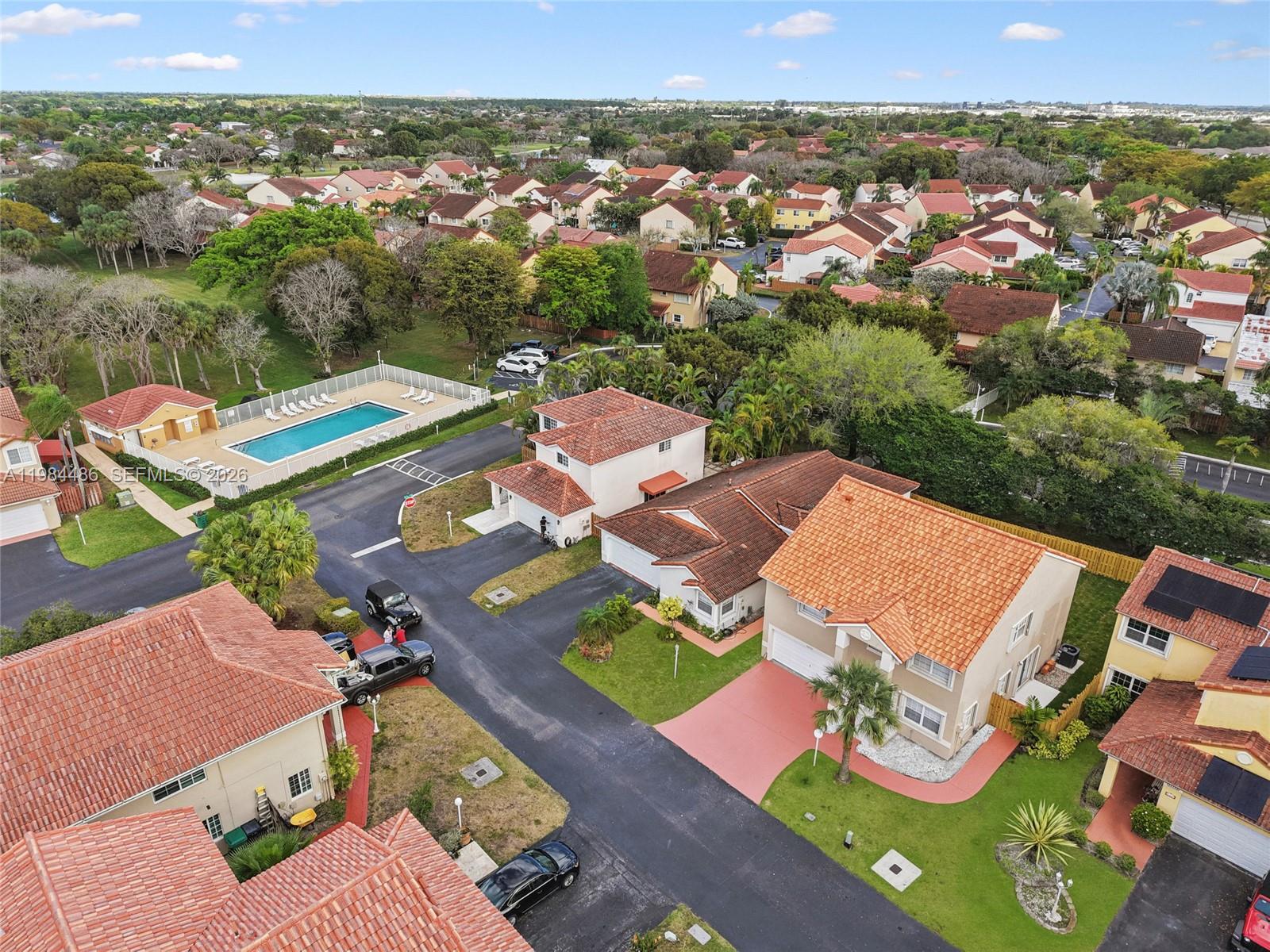 15174 Southwest 111th Street Miami, FL 33196 - Photo 44 of 49 an aerial view of a house with a garden