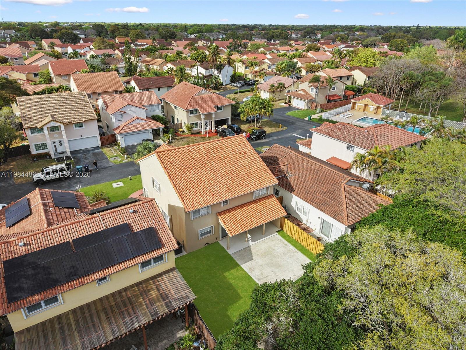 15174 Southwest 111th Street Miami, FL 33196 - Photo 47 of 49 an aerial view of a house with a garden