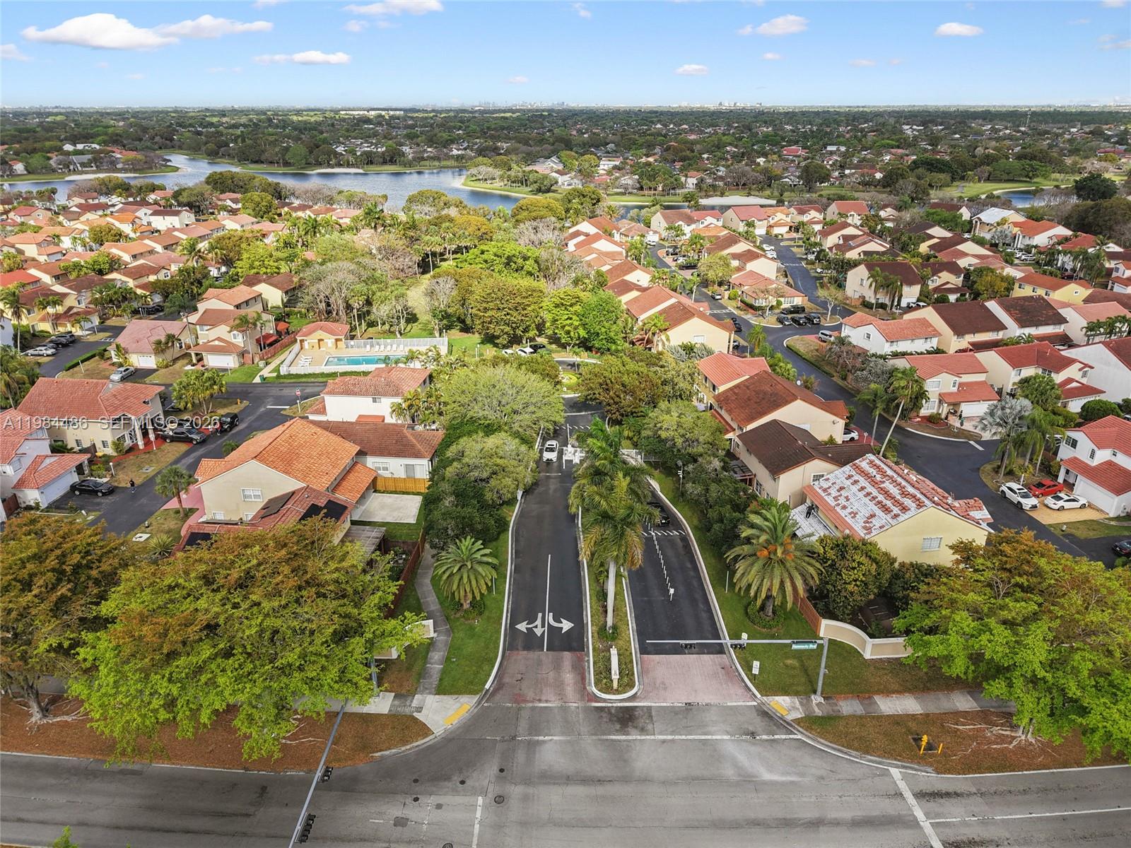 15174 Southwest 111th Street Miami, FL 33196 - Photo 48 of 49 an aerial view of residential houses with outdoor space