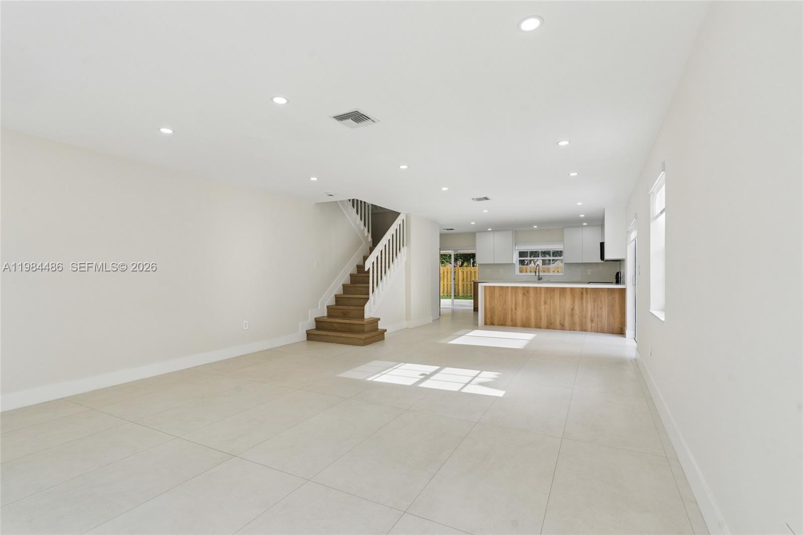 15174 Southwest 111th Street Miami, FL 33196 - Photo 6 of 49 a view of empty room with wooden floor