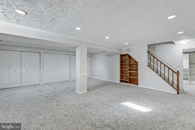 a view of an empty room with stairs