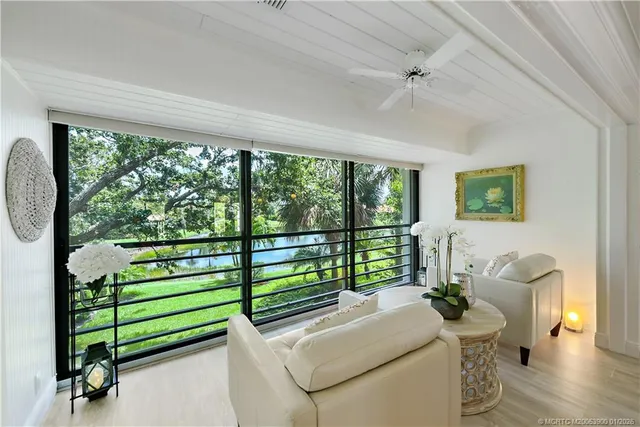 a kitchen with stainless steel appliances granite countertop a refrigerator a stove a sink dishwasher and a refrigerator with wooden floor