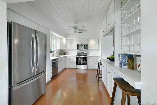 a bathroom with double sink and a mirror