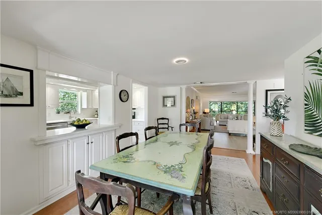 a living room with furniture and flowers