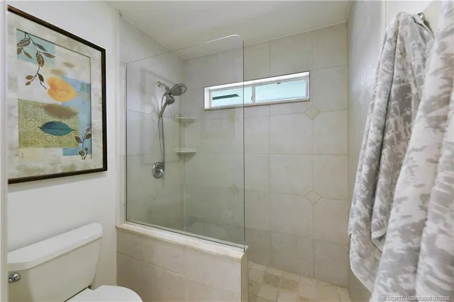 a view of a lake with houses in the back