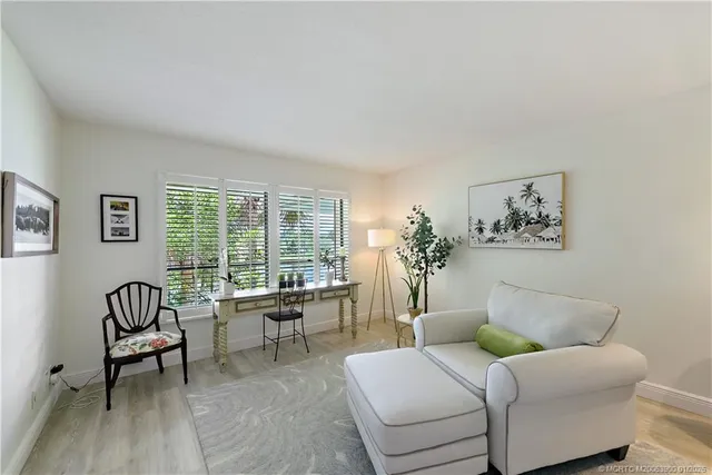 a view of a swimming pool with a table and chairs
