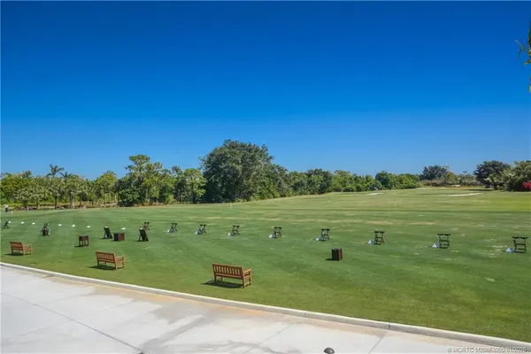 a view of a green field with clear sky