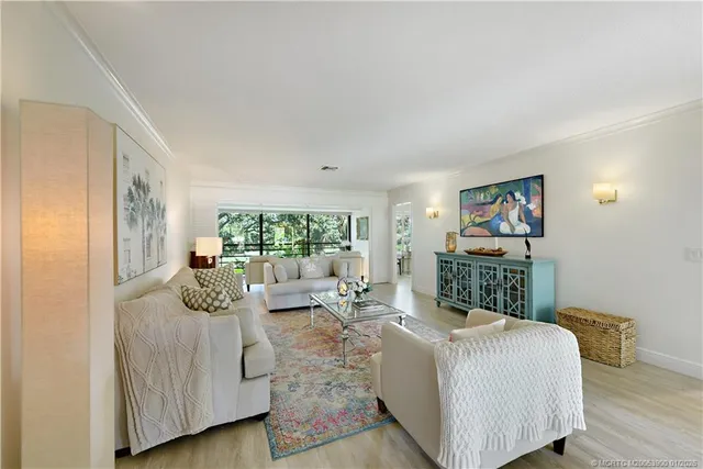 a balcony with furniture and a large window