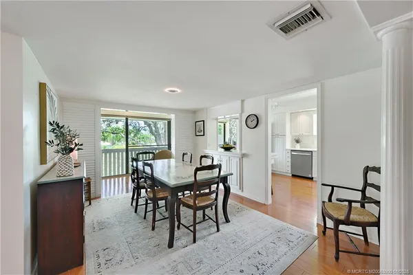 a dining room with furniture and window