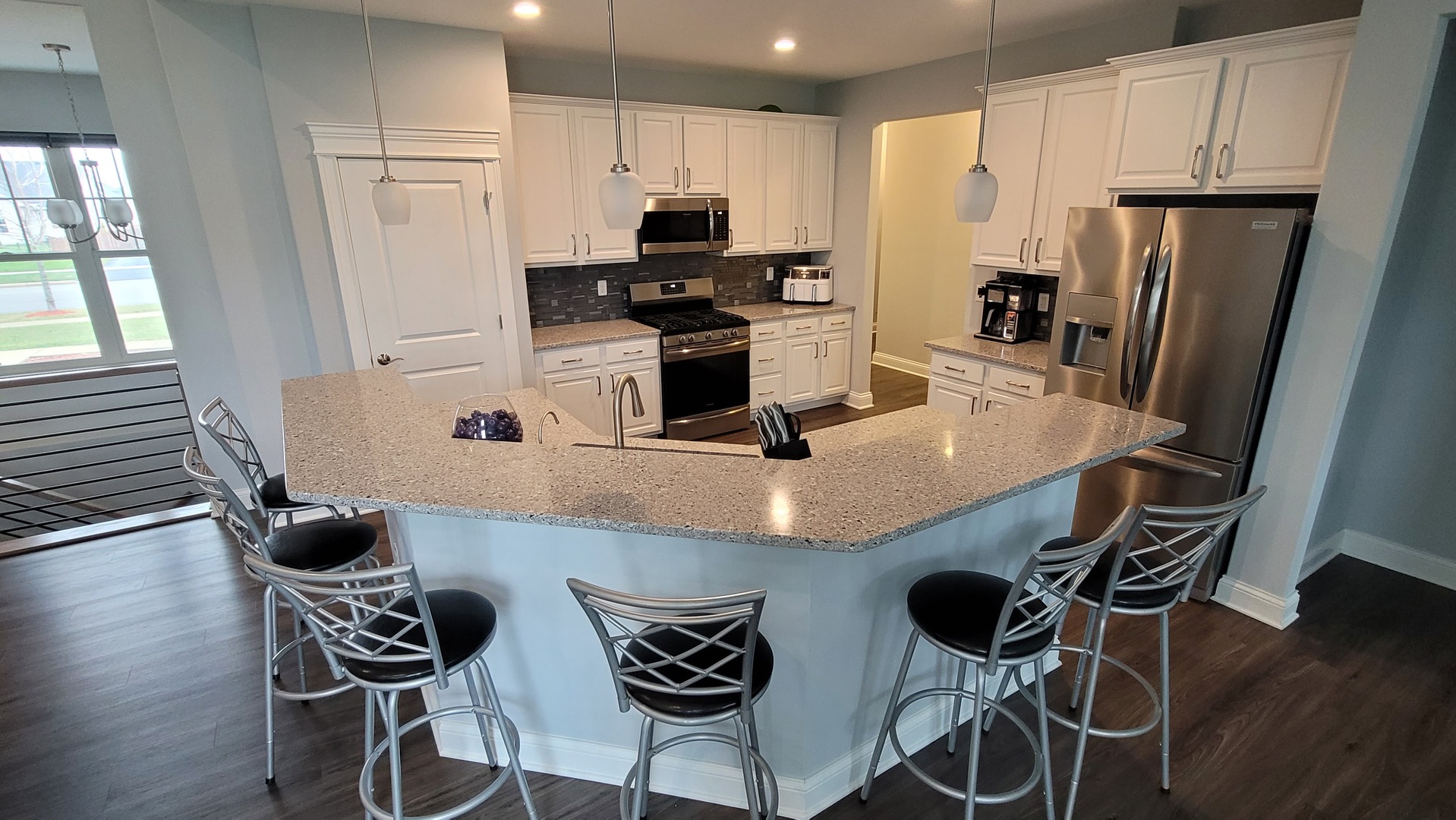 1919 Truman Street Sycamore, IL 60178 - Photo 12 of 50 a kitchen with stainless steel appliances a microwave a sink a stove a refrigerator and cabinets