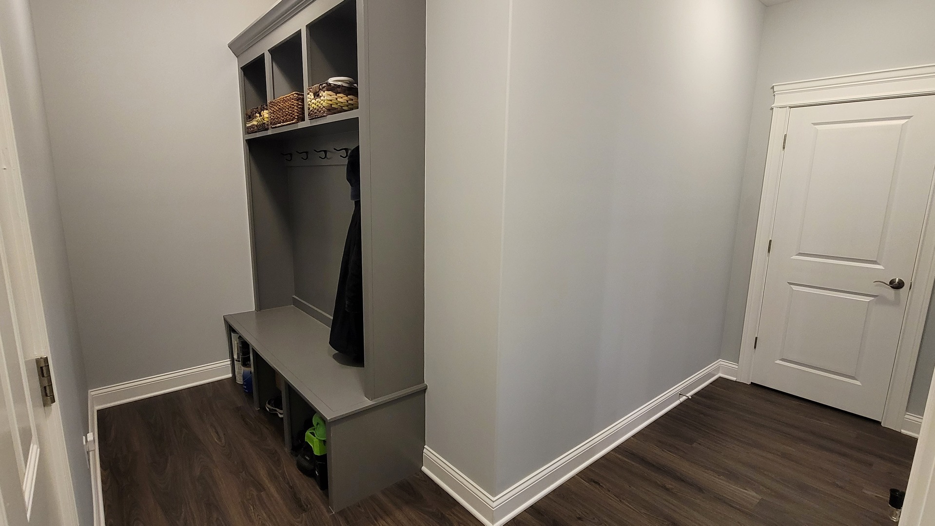 1919 Truman Street Sycamore, IL 60178 - Photo 25 of 50 a room with wooden floor and mirror