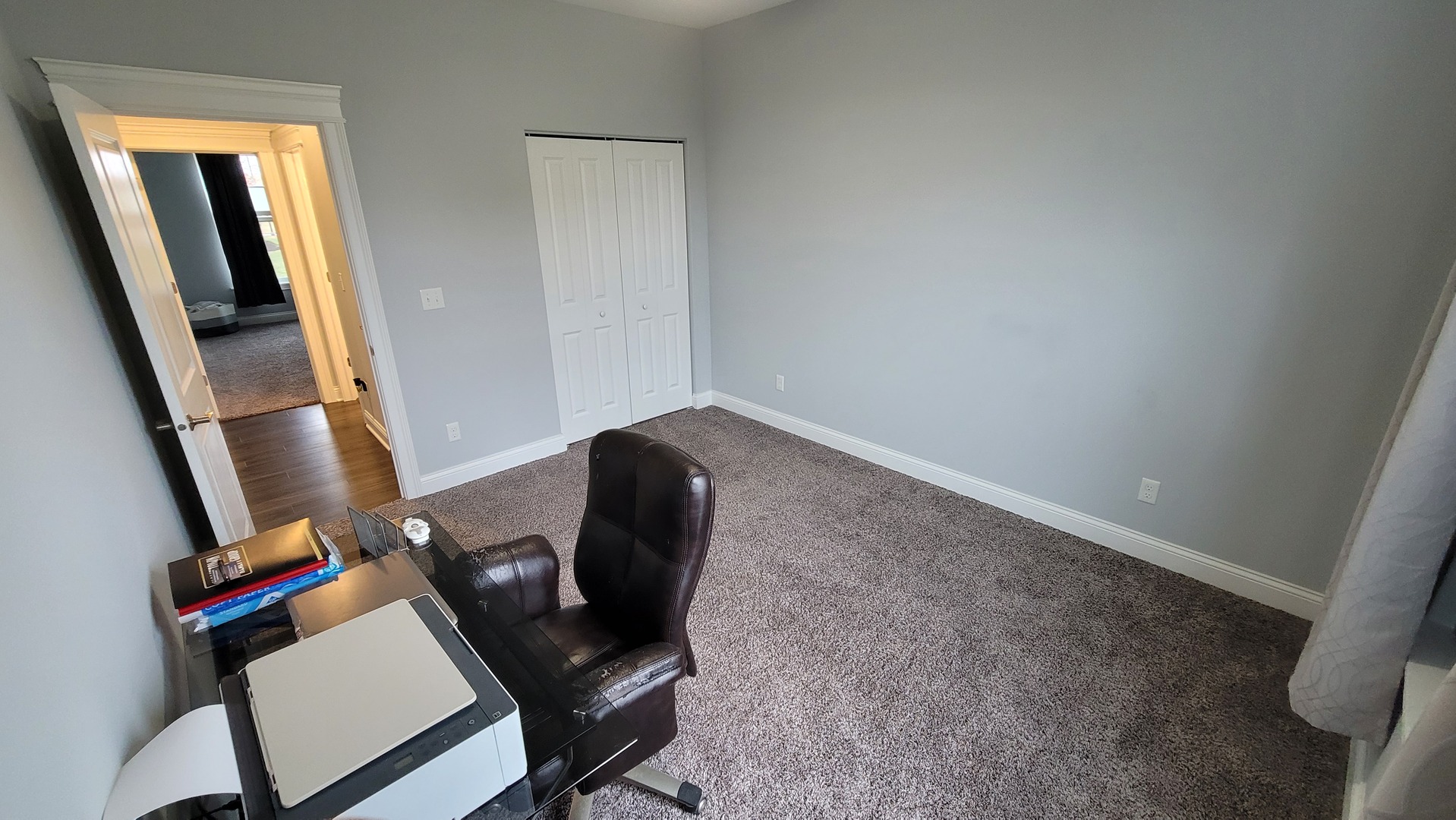 1919 Truman Street Sycamore, IL 60178 - Photo 42 of 50 a view of a workspace with furniture and a window