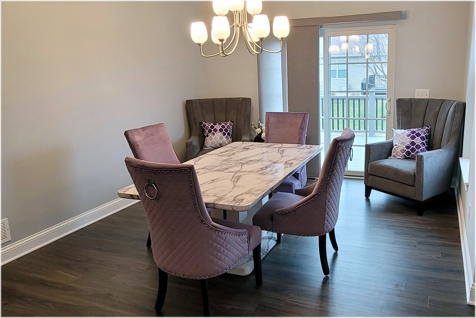 1919 Truman Street Sycamore, IL 60178 - Photo 7 of 50 a view of a dining room with furniture a chandelier and wooden floor