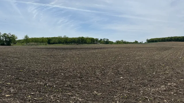 a view of lake with green field