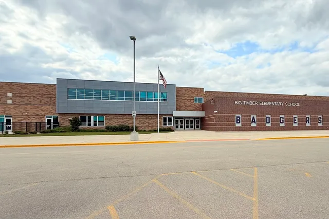 a view of a large building with a big yard