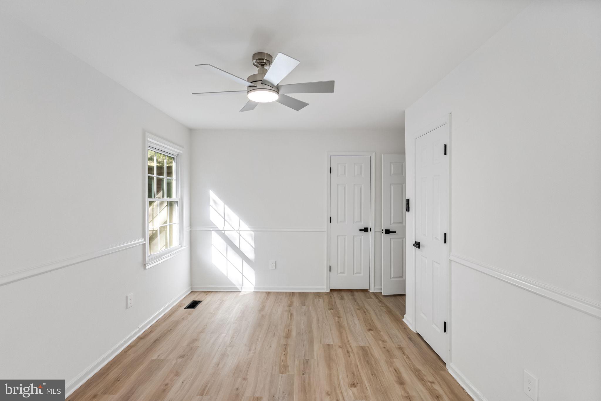 3 Boston Cove Ruther Glen, VA 22546 - Photo 24 of 30 a view of empty room with wooden floor and fan