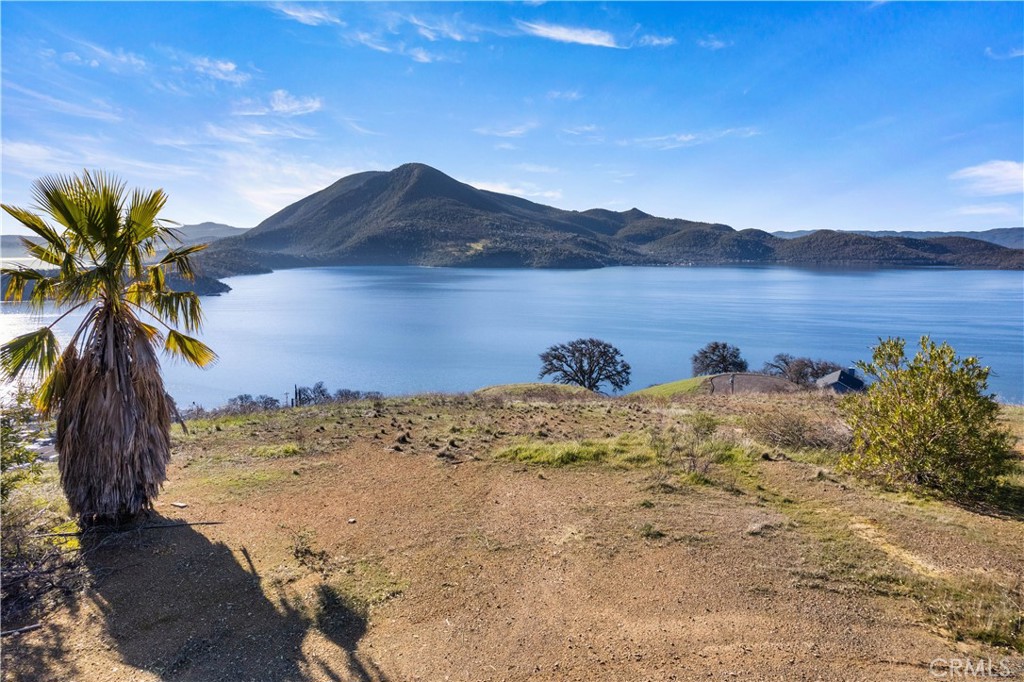 7630 Verna Way Lucerne, CA 95458 - Photo 2 of 26 a view of a lake with a mountain in the background