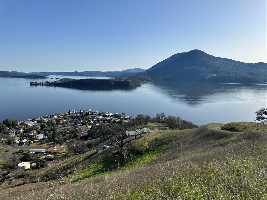 7630 Verna Way Lucerne, CA 95458 - Photo 8 of 26 a view of a lake in middle of forest