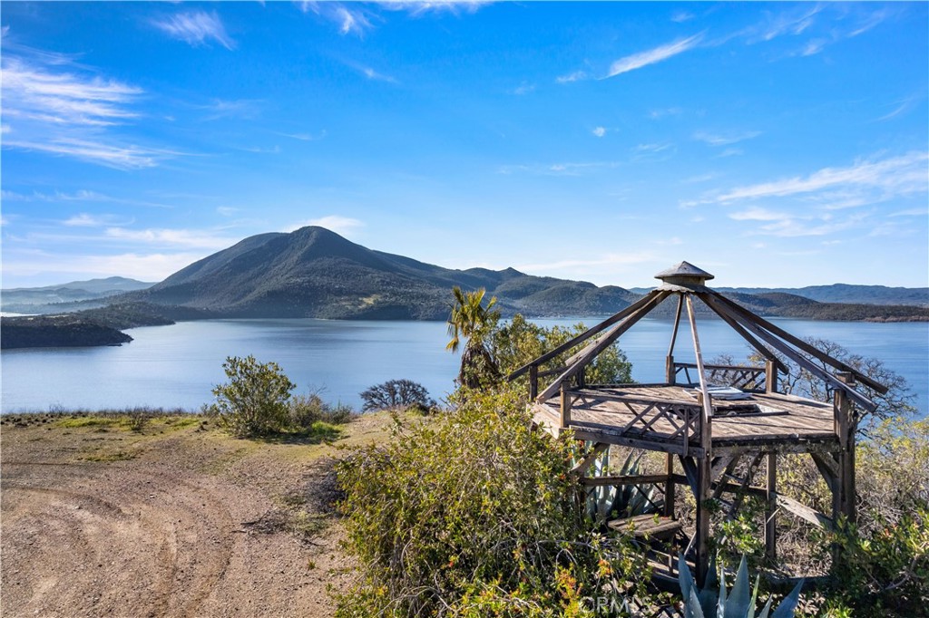 7630 Verna Way Lucerne, CA 95458 - Photo 10 of 26 a view of a house with a yard and potted plants