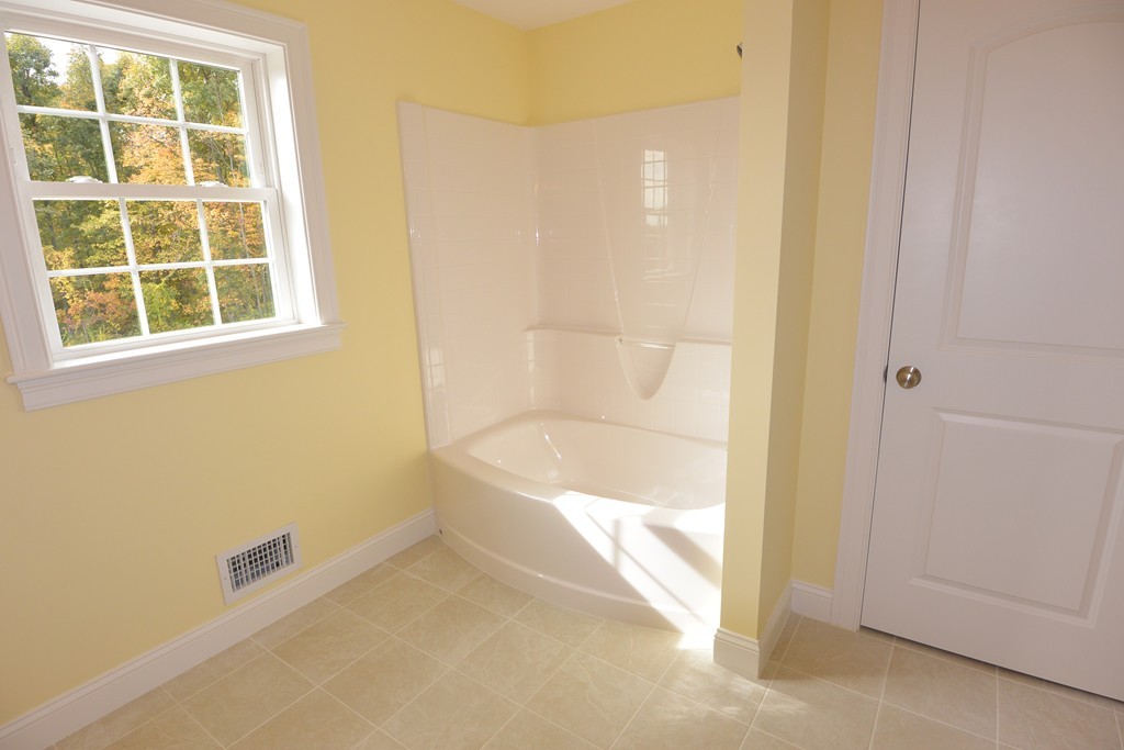 33 Runaway Brook Road Lancaster, MA 01523 - Photo 12 of 15 a bathroom with a bathtub and a shower