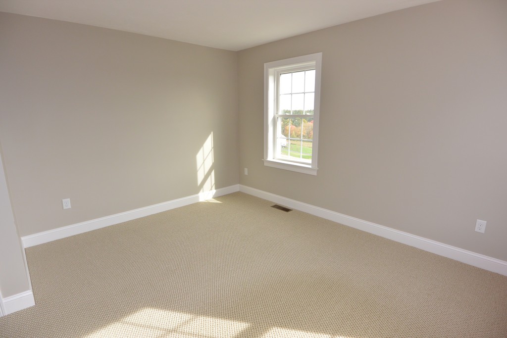 33 Runaway Brook Road Lancaster, MA 01523 - Photo 15 of 15 a view of an empty room and a window