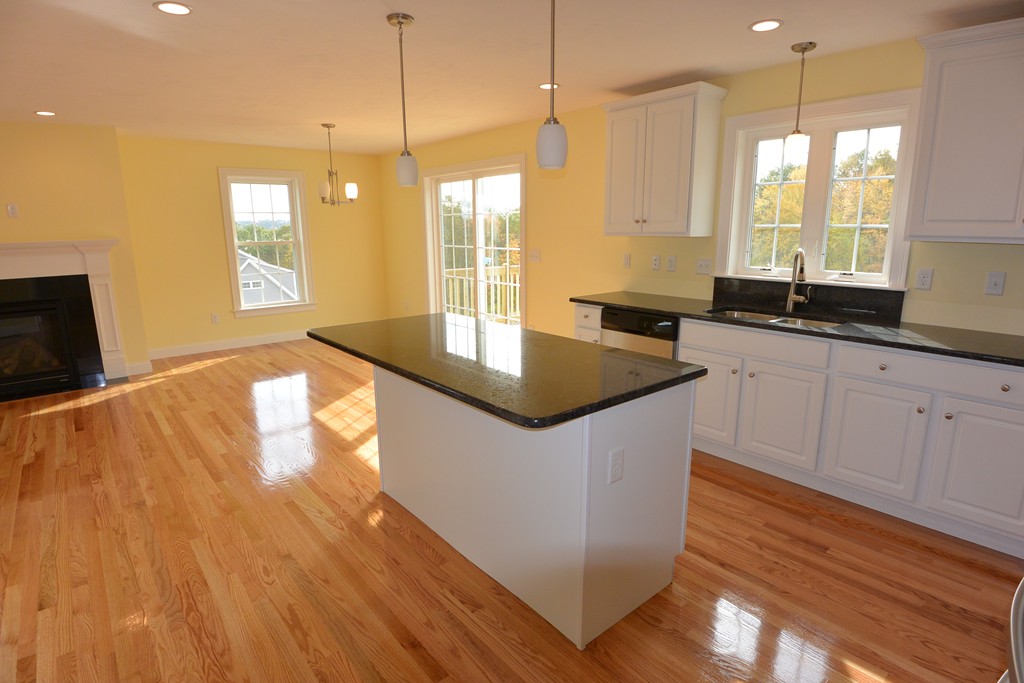 33 Runaway Brook Road Lancaster, MA 01523 - Photo 4 of 15 a kitchen with granite countertop a sink a counter top space and appliances