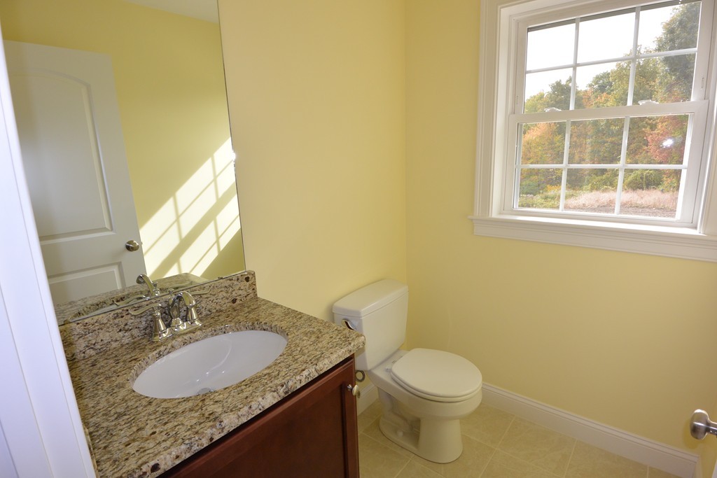 33 Runaway Brook Road Lancaster, MA 01523 - Photo 5 of 15 a bathroom with a granite countertop sink and a mirror