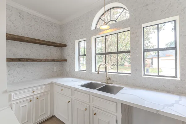 a kitchen with a sink and a window