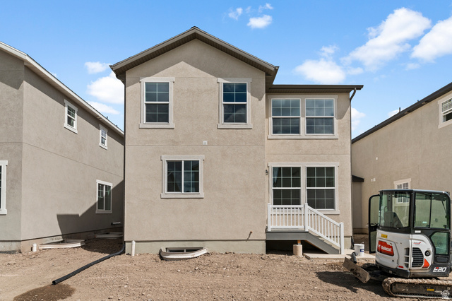 7797 West Alta Springs Way Magna, UT 84044 - Photo 4 of 21 Rear view of house with stucco siding