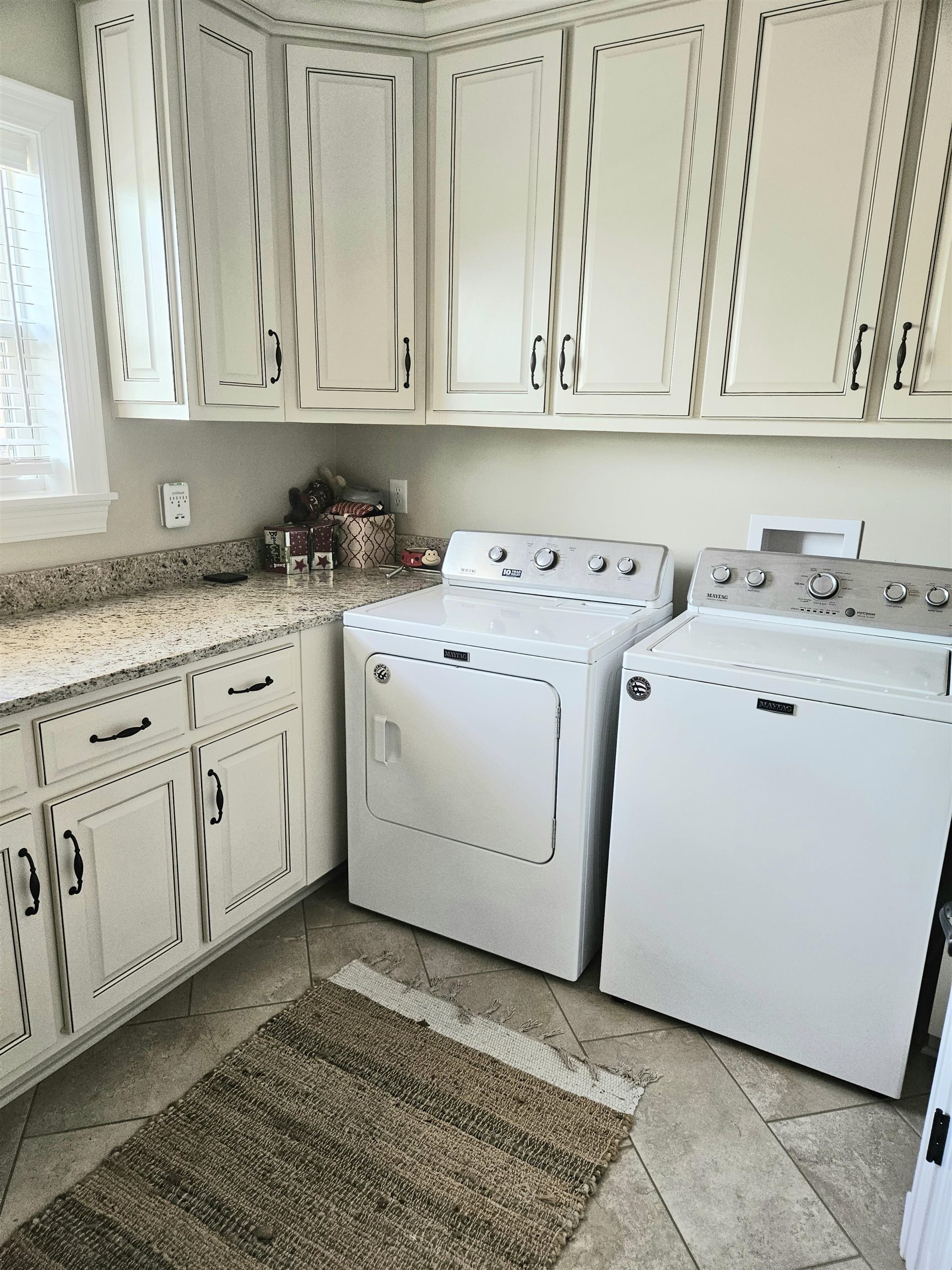 7095 Clifton Road Savannah, TN 38372 - Photo 17 of 25 Laundry room featuring washing machine and clothes dryer and cabinet space