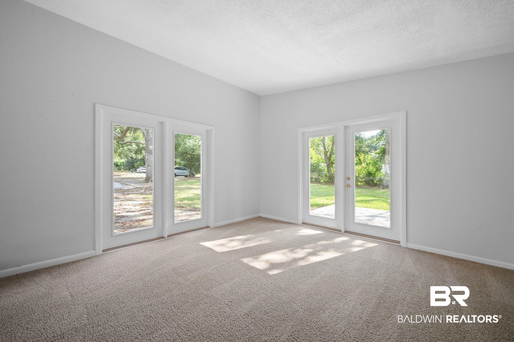 3701 Vista Ridge Drive Mobile, AL 36693 - Photo 21 of 33 Carpeted spare room featuring a textured ceiling and a healthy amount of sunlight