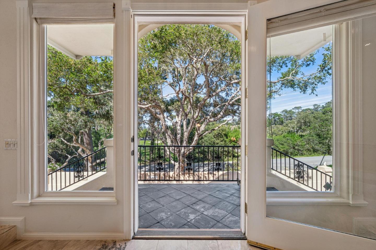 2905 Bird Rock Road Pebble Beach, CA 93953 - Photo 3 of 33 a view of a room with wooden floor and a floor to ceiling window