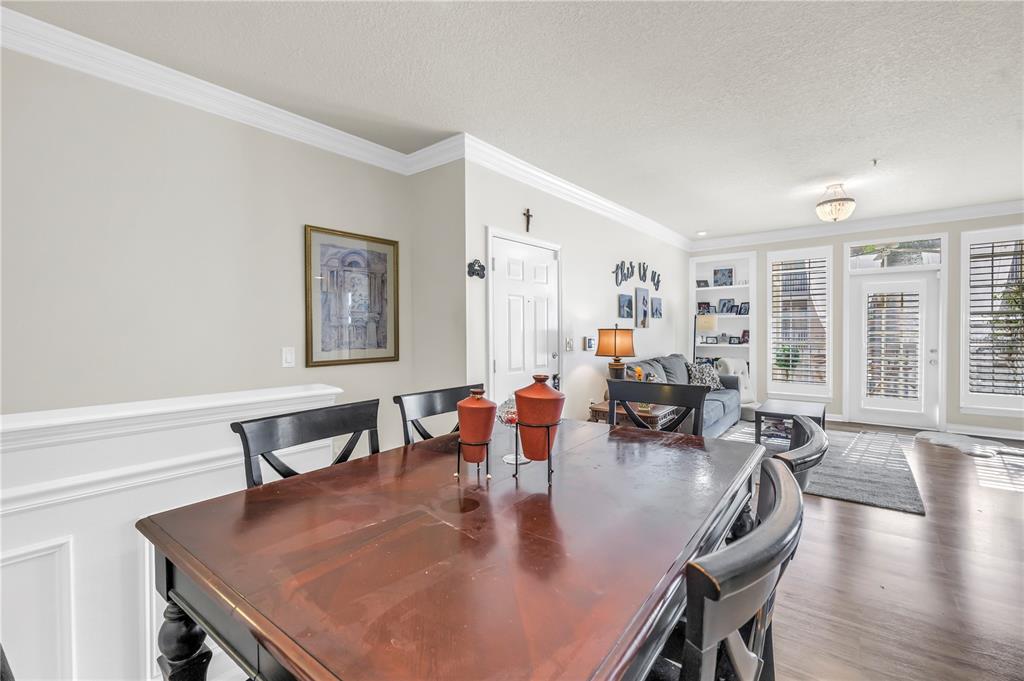 4206 Bay Club Circle, Unit 4206 Tampa, FL 33607 - Photo 16 of 60 a view of a dining room with furniture window and wooden floor