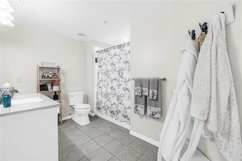 4206 Bay Club Circle, Unit 4206 Tampa, FL 33607 - Photo 20 of 60 a bathroom with a sink toilet and shower