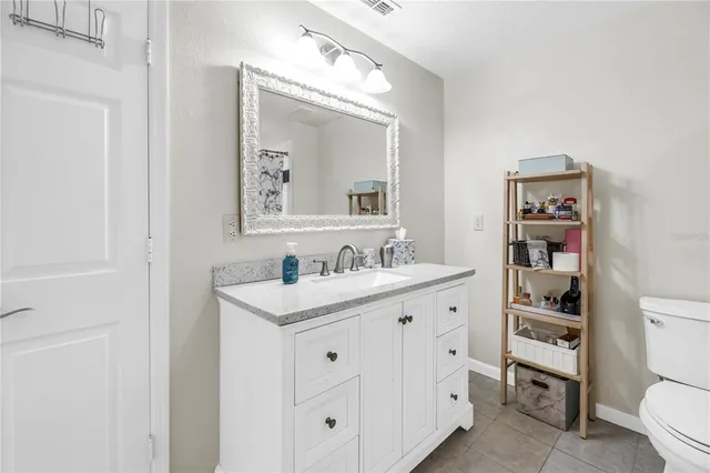 a view of a dining room with furniture and a window