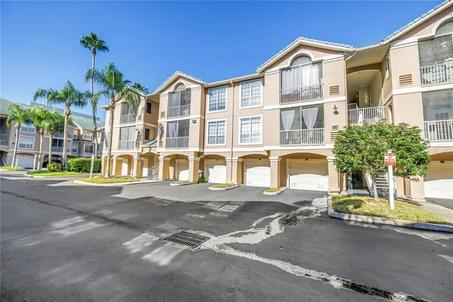 a view of a backyard with swimming pool
