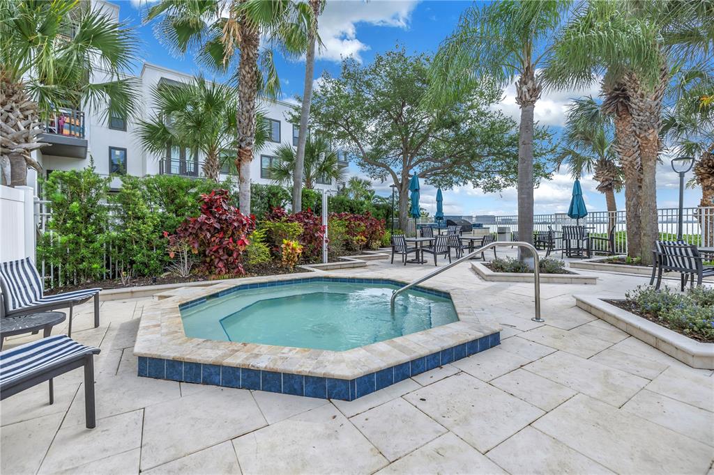 4206 Bay Club Circle, Unit 4206 Tampa, FL 33607 - Photo 39 of 60 a view of outdoor space yard swimming pool and patio