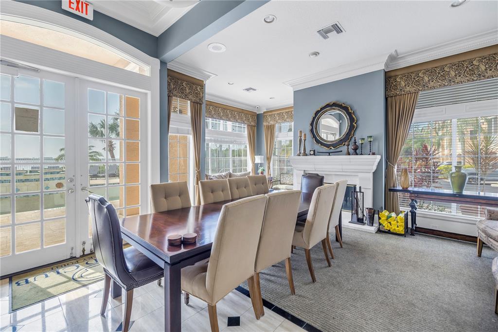4206 Bay Club Circle, Unit 4206 Tampa, FL 33607 - Photo 52 of 60 a view of a dining room with furniture a rug and a large window
