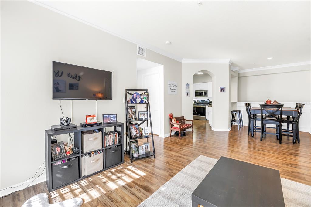 4206 Bay Club Circle, Unit 4206 Tampa, FL 33607 - Photo 7 of 60 a living room with furniture and a flat screen tv