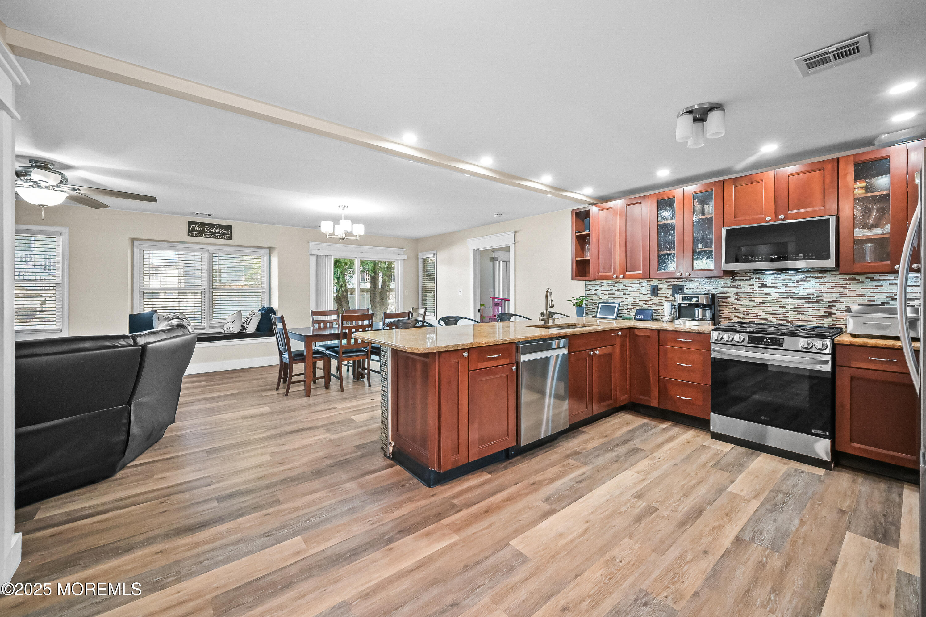 a kitchen with a sink counter top space and stainless steel appliances