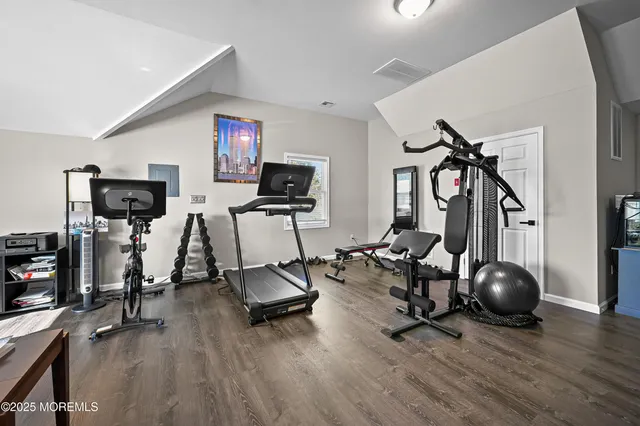 a view of a livingroom with furniture and a flat screen tv