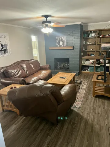 a bedroom with a bed and a fireplace