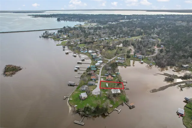 an aerial view of a house with a lake view