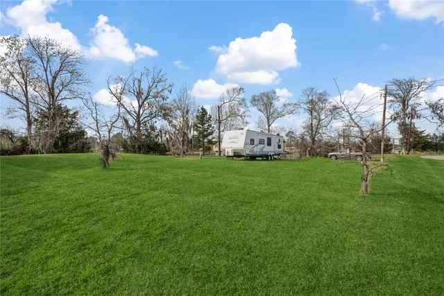 a view of a lake with houses in the back