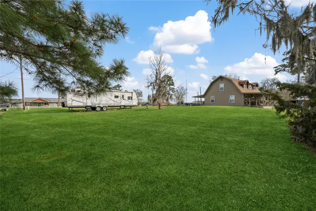 a view of a lake with houses in the back