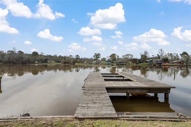 a view of a house with outdoor space and sitting area